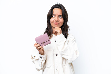 Young hispanic woman holding wallet isolated on white background having doubts