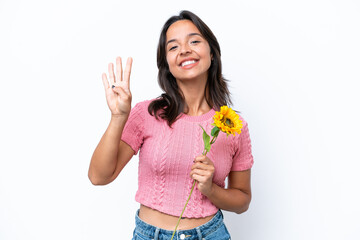 Young hispanic woman holding sunflower isolated on white background happy and counting four with fingers