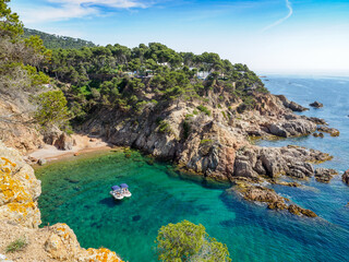 View of secluded cove with emerald green water near Palamos, Catalonia