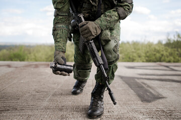 Military soldier throwing a sonic grenade