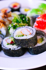 Different portions of sushi with different seasonings.