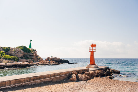 Colored lighthouses in a coastal area of the Mediterranean Sea.