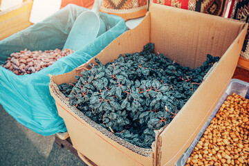 Black raisins or dried grapes selling at local farmers market in Turkey