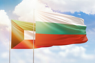 Sunny blue sky and flags of bulgaria and kuwait
