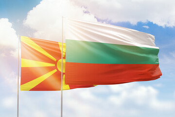 Sunny blue sky and flags of bulgaria and north macedonia