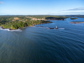 Maritime lighthouse on beautiful beach crossing with river - Itacar&eacute;, Bahia, Brazil