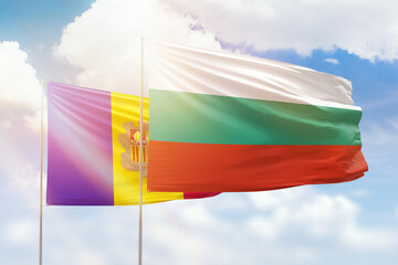 Sunny blue sky and flags of bulgaria and andorra