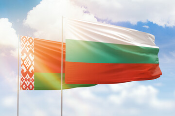 Sunny blue sky and flags of bulgaria and belarus