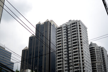 Urban landscape of electric wires and skyscrapers