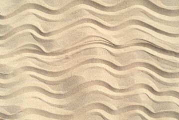 Fototapeta na wymiar Texture of sea sand background closeup with ornament