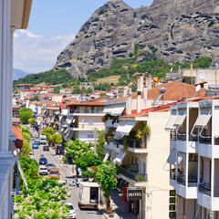 Fototapeta premium nice view from the hotel room to the city and mountains in the background. Greece, kalabaka. close up
