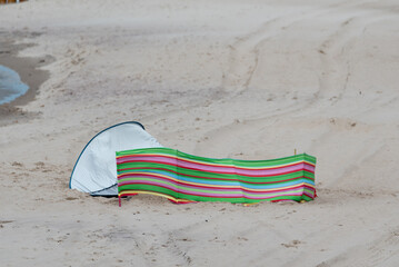 A beach screen with no people. The beginning of the holiday season at the Baltic Sea. A colorful...