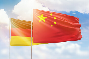Sunny blue sky and flags of china and germany