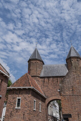 Fototapeta na wymiar Picturesque medieval Kamperbinnenpoort in city of Amersfoort is a rectangular gate in the first city wall from the second half of the 13th century. Amersfoort, the Netherlands.
