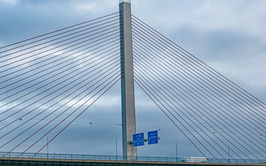 A modern bridge spans the Rhine River near Cologne, Germany.