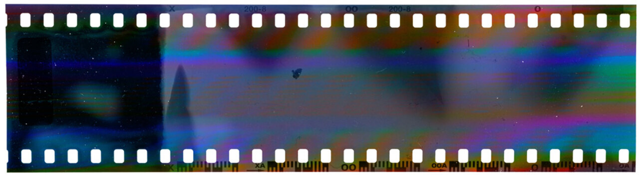 start of 35mm negative filmstrip with cool scanning light interferences