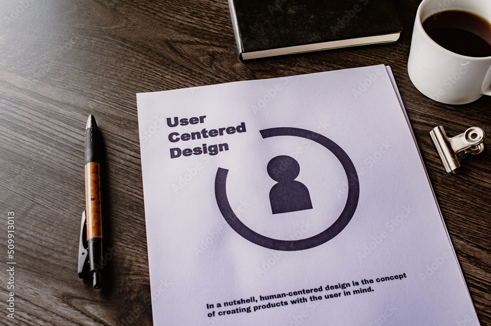 Poster there is dummy documents that created for the photo shoot on the desk about user centered design.