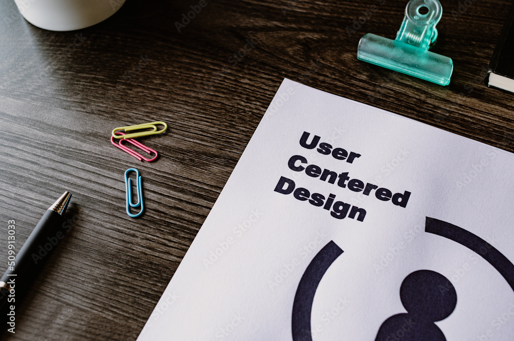 Poster there is dummy documents that created for the photo shoot on the desk about user centered design.