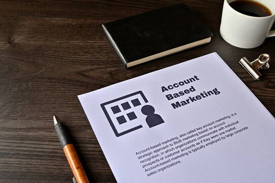 There is dummy documents that created for the photo shoot on the desk about Account Based Marketing.