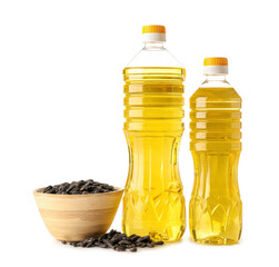 Bottles of oil and bowl with sunflower seeds on white background