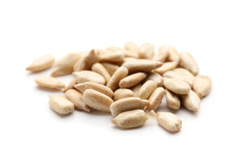 Heap of peeled sunflower seeds on white background