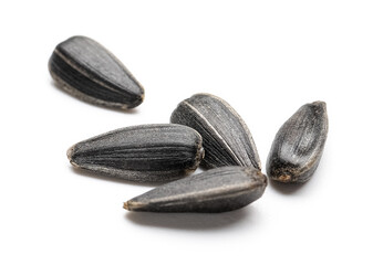 Unpeeled sunflower seeds on white background