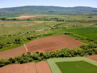 Fototapeta premium Aerial view of rural land near town of Godech, Bulgaria