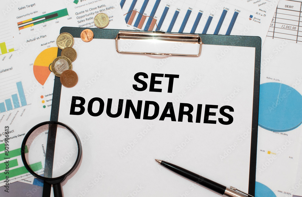 Poster set boundaries on notepad with pen, glasses and calculator