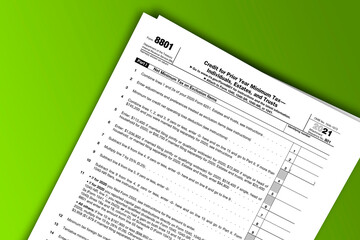 Obraz premium Form 8801 documentation published IRS USA 11.24.2021. American tax document on colored