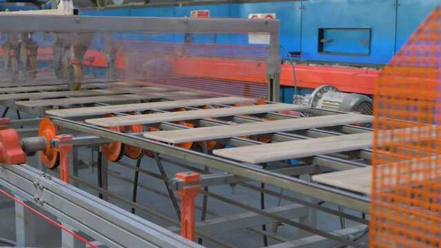 Ceramic tile manufacturing process. Mixture of clays and other natural materials, such as sand, quartz and water. Conveyor belt systems