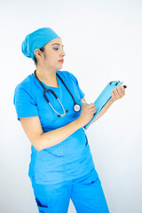 beautiful woman medical, wearing uniform and blue surgical cap, stethoscope on her neck, holding clipboard with results, on white background