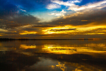 Obraz premium sunset over the river