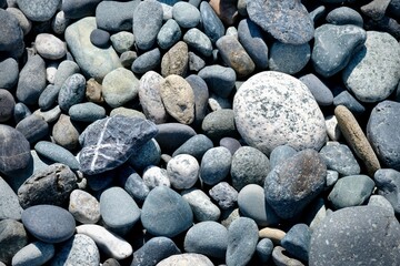 Fototapeta na wymiar Smooth gray beach stones pattern