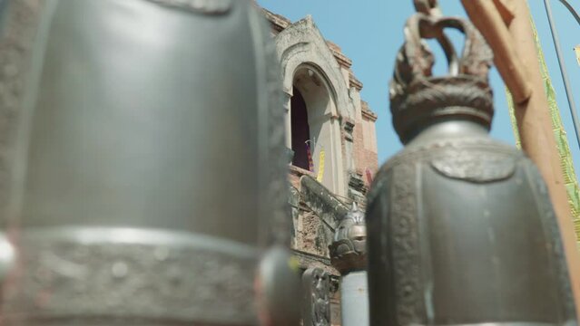 4K Cinematic landscape footage of the buddhist temple monument of Wat Chedi Luang in the old town of Chiang Mai, Thailand on a sunny day.