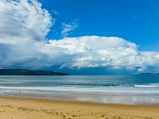 Aerial seascape with Rain Clouds and Blue Sky