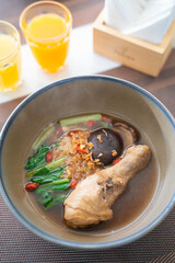 Braised chicken noodles soup serve with vegetable