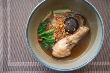 Braised chicken noodles soup serve with vegetable
