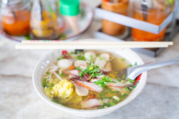 egg noodle soup serve with fish ball and pork