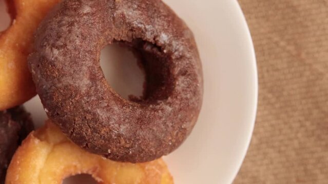 Calorie-rich donuts on a spinning table