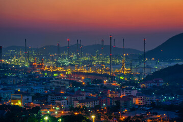 Oil refinery industry factory, petrochemical plant at sunset