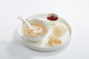 Front view of white bowl of cooked birdnest in white background healthcare food 