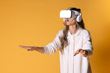 Interactive virtual reality goggles.Asian teen woman wearing VR or Virtual Reality head set for...