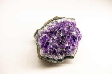 Amethyst geode on the white background, purple gemstone, horizontal image with copy space for text,...