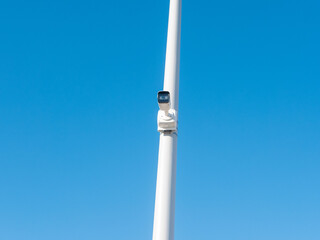 CCTV camera mounted on a pole for street security. Direct view