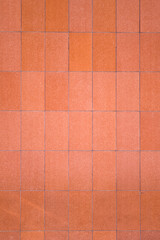 Fototapeta premium Pastel Orange Building Wall in Bright Daylight.