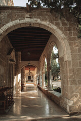 Beautiful arch with lanterns and potted plants in church