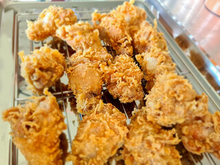 Fried chicken in a food tray served in a buffet style.