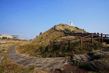 lighthouse and seaside walkway