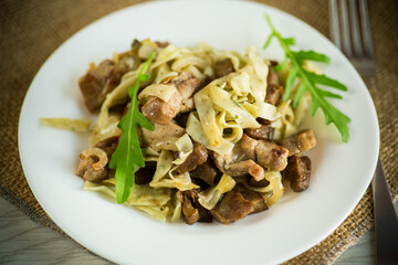 Homemade boiled noodles with meat and eggplant in a plate