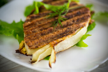 piece of grilled baked cabbage with spices in a plate